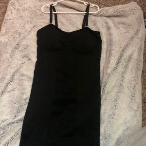 Black shape wearing dress